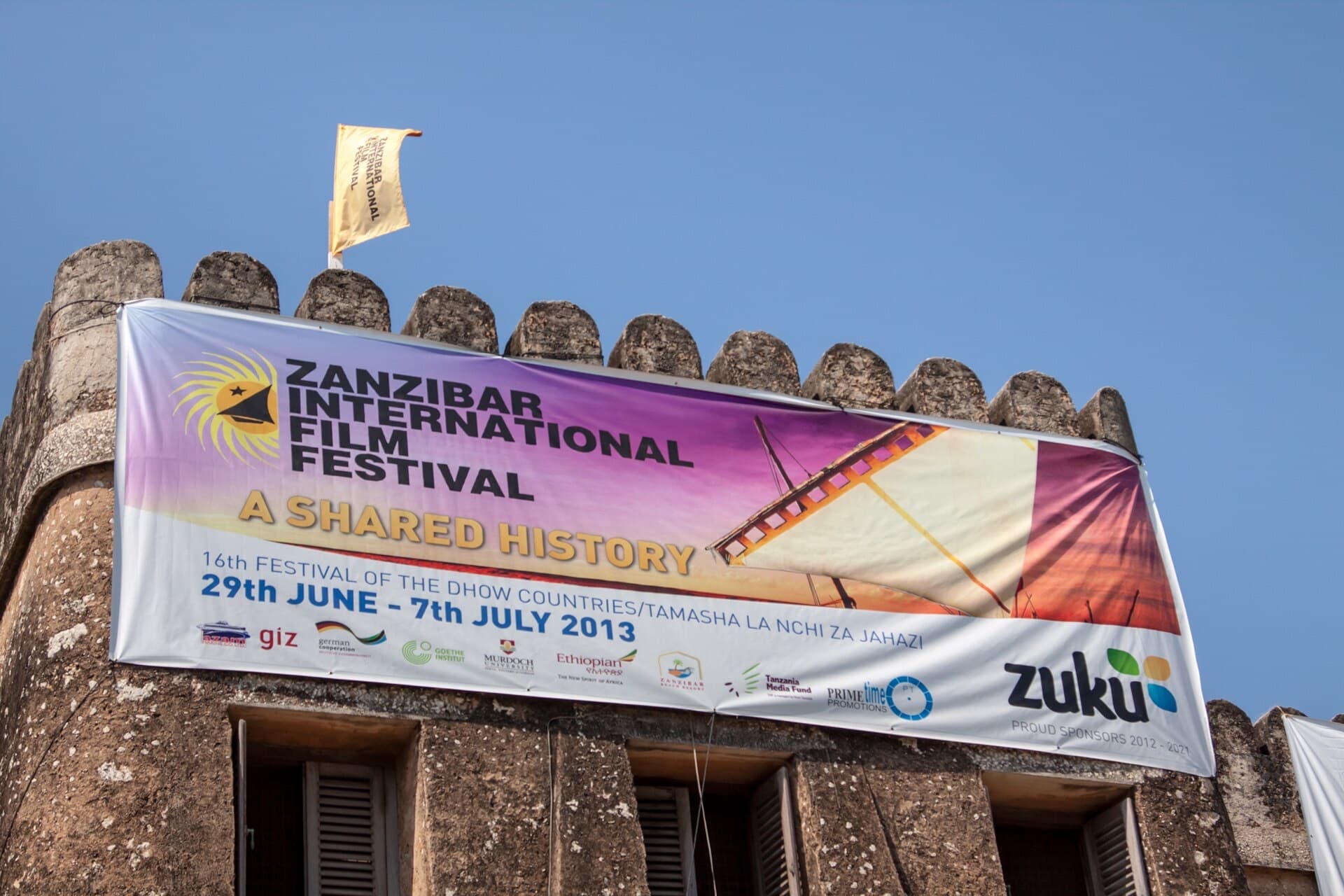 Zanzibar International Film Festival banner draped across the Old Fort wall in Stone Town, Tanzania
