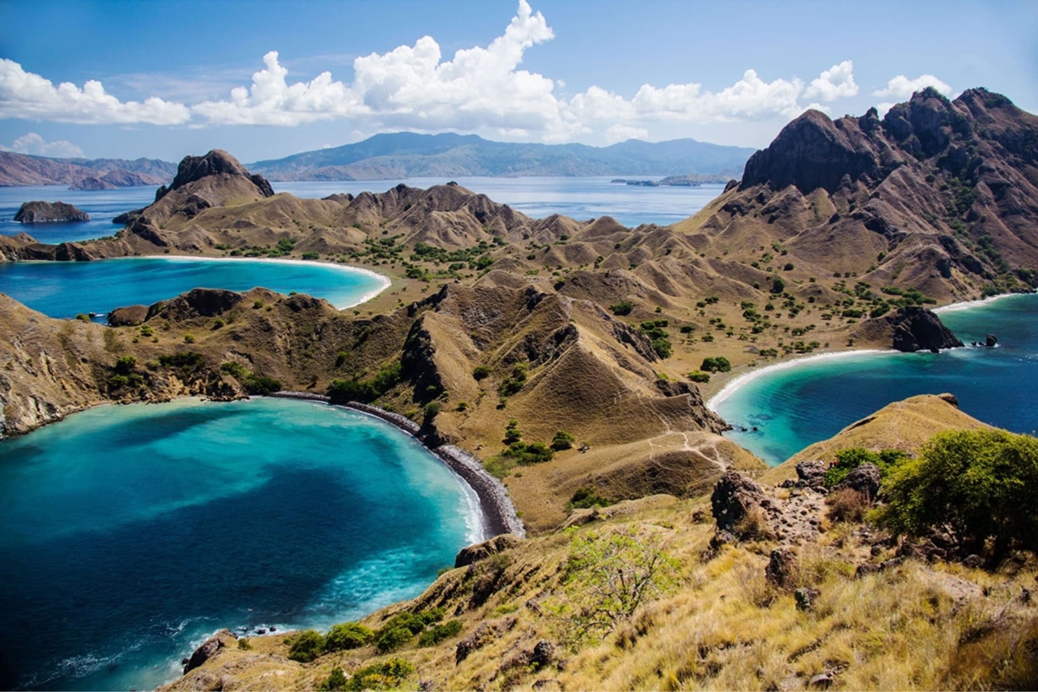 Panoramic view of Padar Island in Komodo National Park with three crescent bays in different colors of turquoise