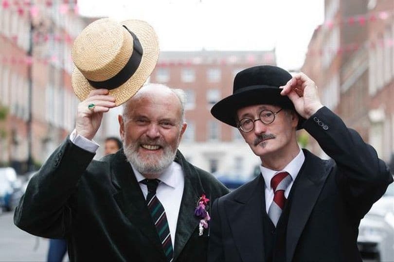 Two men in Edwardian dress with bowler hats and boater hats during Bloomsday celebrations in Dublin