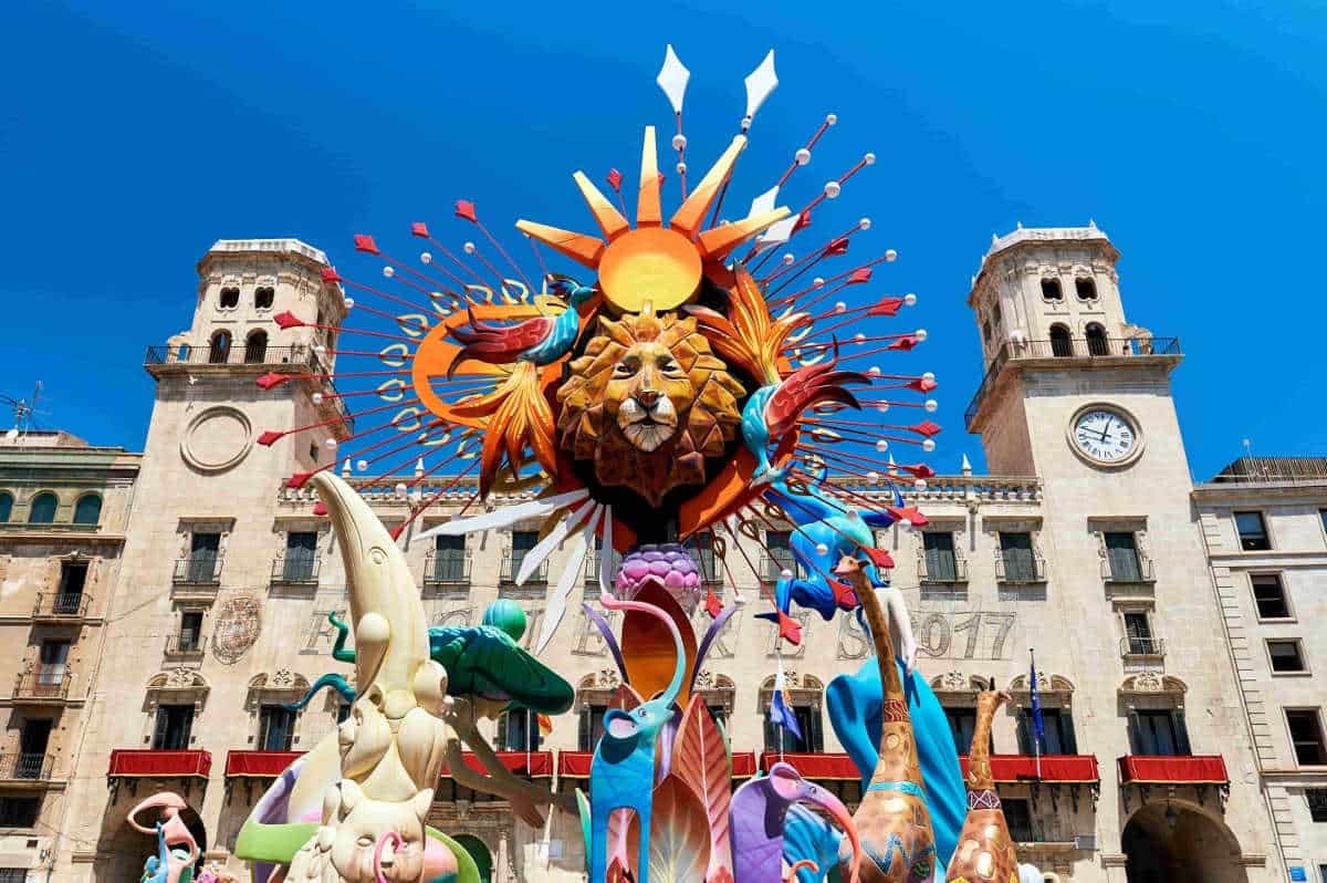 Giant lion-shaped ninot sculpture in front of Alicante's town hall during Hogueras de San Juan in Spain
